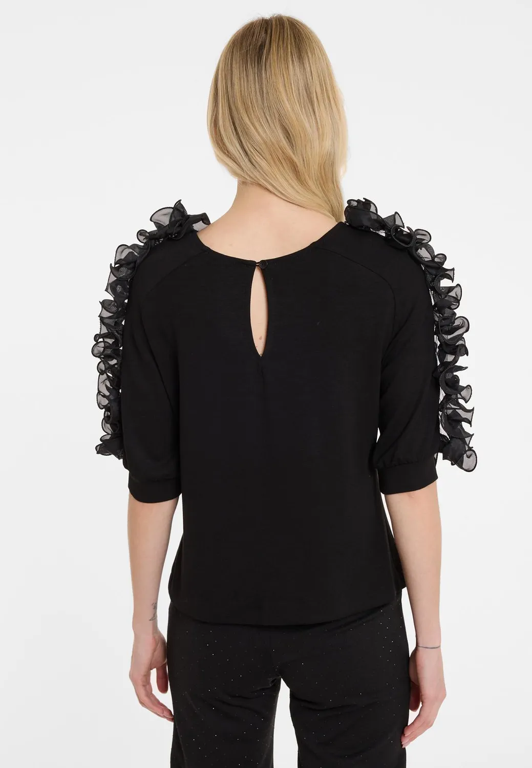 Ana Alcazar Agrali top nero jersey volant chiffon