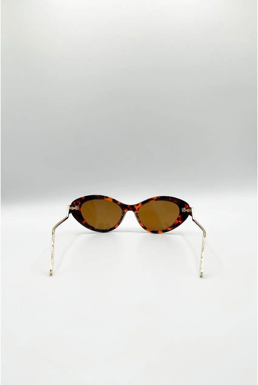 SVNX Occhiali Sole Cat-Eye Marroni Dettaglio Metallo Oro