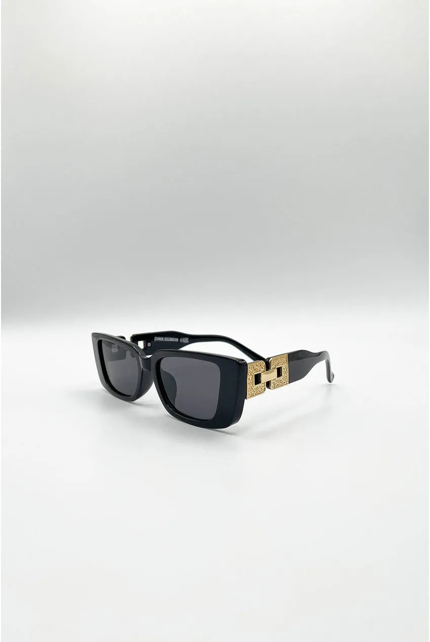 SVNX SG2601802 occhiali sole neri oro cat-eye rettangolari