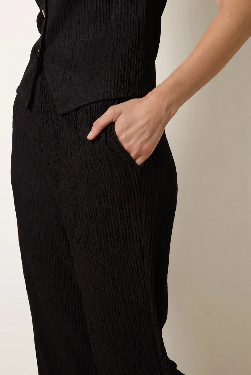 Blue Vanilla SS26008B003 pantaloni neri a zampa vita elasticizzata
