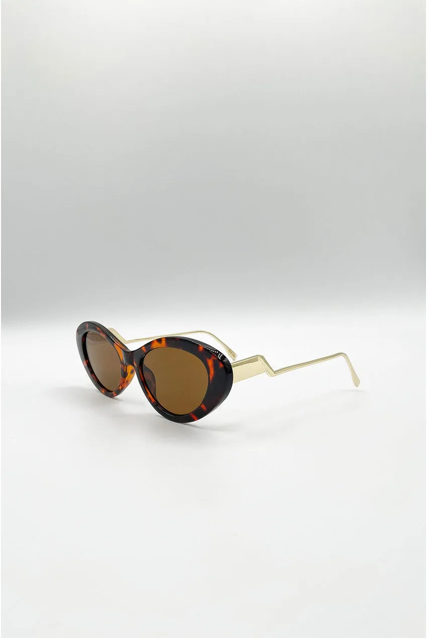 SVNX Occhiali Sole Cat-Eye Marroni Dettaglio Metallo Oro