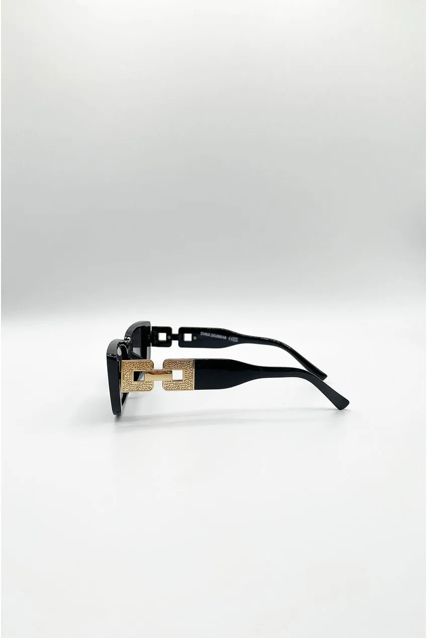 SVNX SG2601802 occhiali sole neri oro cat-eye rettangolari