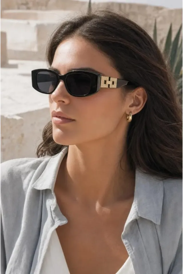 SVNX SG2601802 occhiali sole neri oro cat-eye rettangolari