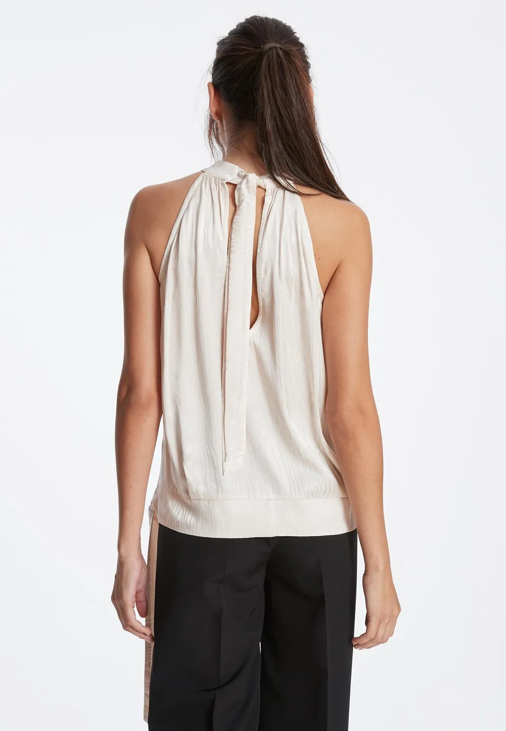 Ana Alcazar Zarla top raso avorio con fiore